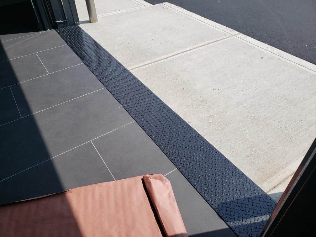 Custom stainless steel case study project at the Gen 5 Porsche Center in Nashua